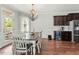 Bright dining room featuring elegant chandelier and backyard access at 218 Darecrest Ln, Wendell, NC 27591