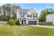 Beautiful two-story home featuring a well-kept lawn, gray siding, and a welcoming two-car garage at 218 Darecrest Ln, Wendell, NC 27591