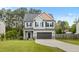 Charming two-story home with gray siding, black shutters, and a well-manicured front lawn at 218 Darecrest Ln, Wendell, NC 27591