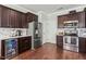 Modern kitchen featuring stainless steel appliances and dark cabinets at 218 Darecrest Ln, Wendell, NC 27591