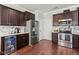 Well-equipped kitchen with stainless steel appliances and dark wood cabinetry at 218 Darecrest Ln, Wendell, NC 27591
