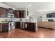 Open concept kitchen and living area with modern appliances at 218 Darecrest Ln, Wendell, NC 27591
