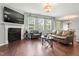 Bright living room featuring hardwood floors, a fireplace, and comfortable seating at 218 Darecrest Ln, Wendell, NC 27591