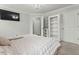 Relaxing main bedroom with a chandelier and ample closet space at 218 Darecrest Ln, Wendell, NC 27591