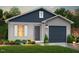 Charming single-story home featuring vinyl siding, a gray front door, and a well-manicured lawn at 224 Landon Pl, Roxboro, NC 27573