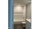 Modern bathroom features a tiled shower and tub combination with a built-in niche for storage at 237 Landon Pl, Roxboro, NC 27573