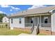 Exterior shows a back porch with steps leading to the yard at 241 Connelly Way, Zebulon, NC 27597