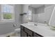 Bathroom featuring a window and modern fixtures at 241 Connelly Way, Zebulon, NC 27597