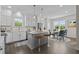 Bright, airy kitchen featuring a center island, modern appliances, and a breakfast nook at 241 Connelly Way, Zebulon, NC 27597
