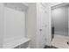 Mudroom with built-in storage bench and coat hooks near the laundry room at 241 Connelly Way, Zebulon, NC 27597