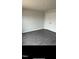 Bedroom with wood-look flooring, neutral walls, and a double door closet at 249 Landon Pl, Roxboro, NC 27573
