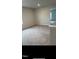 Cozy loft area with soft carpeting and a view into another room at 249 Landon Pl, Roxboro, NC 27573