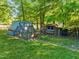 Yard featuring two chicken coops among the lush greenery at 2509 Nc 57, Hillsborough, NC 27278