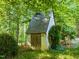 Charming outbuilding with stone and wood and verdant vine at 2509 Nc 57, Hillsborough, NC 27278