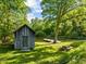 Scenic pond with dock, surrounded by lush grass and mature trees at 2509 Nc 57, Hillsborough, NC 27278