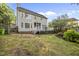 This backyard features a two-story home and a deck at 2808 Polesdon Ct, Raleigh, NC 27615