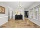 Bright dining room boasts hardwood floors, elegant chandelier and convenient access to other living spaces at 2808 Polesdon Ct, Raleigh, NC 27615