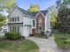 Charming two-story home with brick accents, a landscaped yard, and a walkway leading to the front entrance at 2808 Polesdon Ct, Raleigh, NC 27615