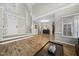 View of the entry foyer with hardwood floors, stairs, and a glimpse of other living spaces at 2808 Polesdon Ct, Raleigh, NC 27615