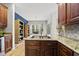Well-equipped kitchen with granite countertops, stainless steel sink and seamless flow to dining area at 2808 Polesdon Ct, Raleigh, NC 27615