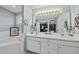 Main bathroom featuring double sinks, vanity, tub and an open doorway to the main bedroom at 2808 Polesdon Ct, Raleigh, NC 27615