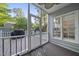 View of screened porch with a grill, perfect for enjoying the outdoors in comfort and privacy at 2808 Polesdon Ct, Raleigh, NC 27615