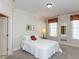 Bright bedroom featuring a bed, a lamp, and patterned window valances at 2813 Market Bridge Ln # 204, Raleigh, NC 27608