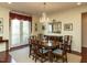 Charming dining area featuring a chandelier, french doors to a balcony, and neutral walls, great for hosting gatherings at 2813 Market Bridge Ln # 204, Raleigh, NC 27608