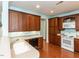 Well-equipped kitchen featuring classic wood cabinetry, modern appliances, and hardwood floors, perfect for culinary enthusiasts at 2813 Market Bridge Ln # 204, Raleigh, NC 27608