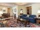 Comfortable living room flowing into dining area, with a cozy blue sofa, coffee table and nice decor at 2813 Market Bridge Ln # 204, Raleigh, NC 27608