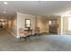 Lobby featuring carpet, sitting area, and elevator at 2813 Market Bridge Ln # 204, Raleigh, NC 27608