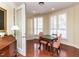 Bright sitting area featuring a small table, lots of windows, and hardwood floors, perfect for relaxing at 2813 Market Bridge Ln # 204, Raleigh, NC 27608