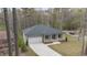 An aerial view showcasing the home's roofline and expansive driveway at 3011 Bourbon St, Sanford, NC 27332