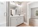 Bathroom features a double sink vanity with modern fixtures and access to the shower at 3011 Bourbon St, Sanford, NC 27332