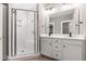 Bathroom features a double sink vanity, modern fixtures, and a tiled walk-in shower at 3011 Bourbon St, Sanford, NC 27332