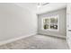 Bedroom featuring neutral walls, plush carpet, and a bright window at 3011 Bourbon St, Sanford, NC 27332