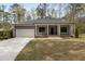 Charming single-story home featuring a garage and inviting front porch at 3011 Bourbon St, Sanford, NC 27332