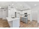 Bright kitchen featuring an island, stainless appliances, and modern pendant lights at 3011 Bourbon St, Sanford, NC 27332