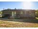 Home's backyard featuring a spacious deck and mature trees at 305 Gillis Rd, Roxboro, NC 27574