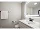 Modern bathroom with sleek vanity, illuminated mirror, and black hardware at 305 Gillis Rd, Roxboro, NC 27574
