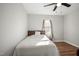 Cozy bedroom featuring hardwood floors, a neutral color palette, and lots of light at 305 Gillis Rd, Roxboro, NC 27574