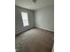 Cozy bedroom with neutral carpet and natural light at 308 Caroline Dr, Wendell, NC 27591