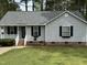 Charming single-Gathering home with gray siding, manicured lawn, and lovely curb appeal at 308 Caroline Dr, Wendell, NC 27591