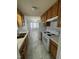 Efficient kitchen with practical layout, white appliances, and plenty of natural light at 308 Caroline Dr, Wendell, NC 27591