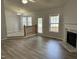 Bright living room with fireplace and hardwood floors at 308 Caroline Dr, Wendell, NC 27591