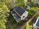 Aerial view of the home showcasing a spacious backyard with lush landscaping at 308 Sunset Creek Cir, Chapel Hill, NC 27516
