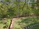 Picture of a lush backyard surrounded by mature trees and greenery at 308 Sunset Creek Cir, Chapel Hill, NC 27516