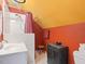 Bathroom with red walls and a white shower stall at 308 Sunset Creek Cir, Chapel Hill, NC 27516