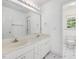 Bathroom featuring a double vanity, large mirror, and bright natural light at 308 Sunset Creek Cir, Chapel Hill, NC 27516