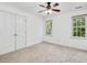Bedroom with carpet flooring, double closet, and bright natural light at 308 Sunset Creek Cir, Chapel Hill, NC 27516